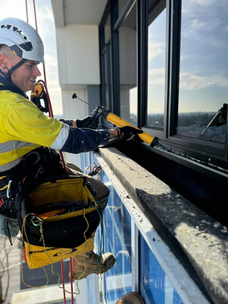 connect acces technician performing sealant maintenance